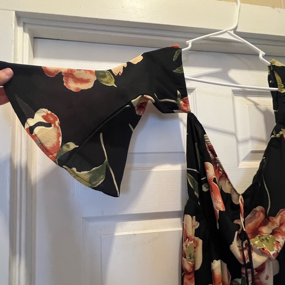 NWOT. Black flowy floral off the shoulder 3/4 sleeve romper. - Picture 11 of 11